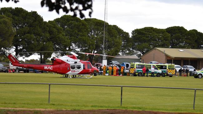 Photo of Two Wells oval as pararmedics respond to seriously injured Angle Vale player Craig Wilson on Saturday July 21. Photo: Daniel Baldwin