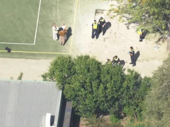 Police speak to school staff. Picture: Seven News