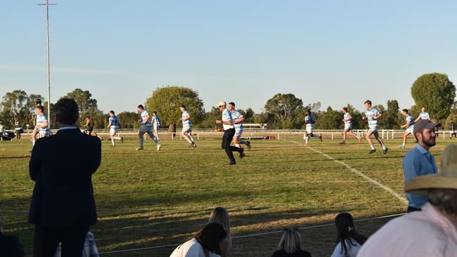 Spectators cheer on as they watch the A Grade Roma vs Condamine match at the Roma Rugby Races at Bassett Park. Picture: Chloe Cufflin.