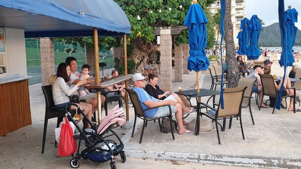 The ex-PM (centre) was papped lounging by the beach. Picture: Twitter.