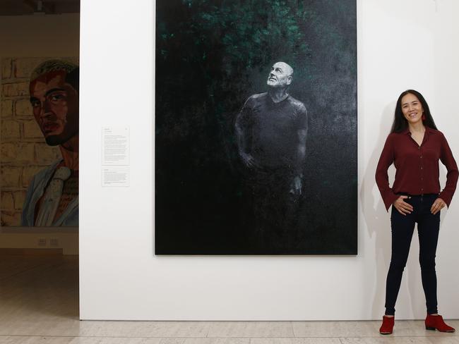 “This painting has about 15 layers of grey and red at its base,” says Zu. Those layers of grey and red combine to create a strangely rich and vivid black. This represents the kelp and in the portrait Flannery is emerging from it, like a beacon of hope. Picture: John Appleyard