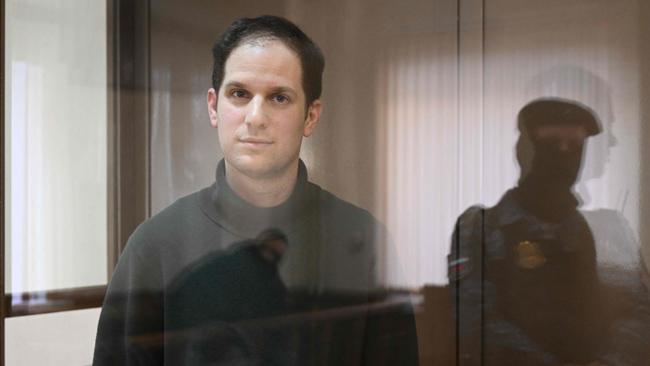 US journalist Evan Gershkovich, arrested on espionage charges, stands inside a defendants' cage before a hearing to consider an appeal on his extended pre-trial detention in Moscow. Picture: AFP.