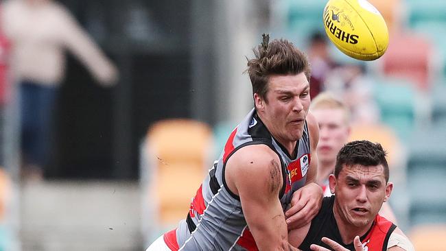 Haydn Smith from Lauderdale and Dakota Bannister of North Launceston race for possession in the Tasmanian State League grand final. Picture: NIKKI DAVIS-JONES