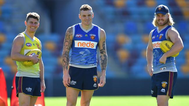 Brisbane skipper Dayne Zorko, left, with teammates Mitch Robinson and Daniel Rich.