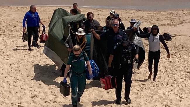 A woman was rushed to hospital with facial injuries after a shark attack near the Port Noarlunga jetty on Friday. Picture: 7NEWS