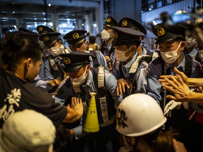 Protesters and police clash in Tokyo. Picture: Getty Images