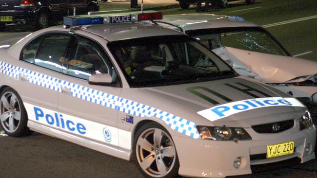 11/4/04. A white VL Commodore crashed whilst being pursued by Police at Rocky Point Road, Sans Souci. It collided with a dark coloured Audi which was parked at the Kerb before  hitting a police car. P