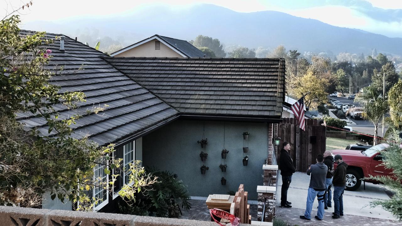 Ventura County Sheriff's deputies stand outside the house of shooting suspect David Ian Long in Newbury Park, California. Picture: AP