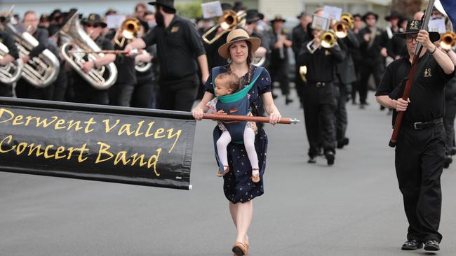 Sarah Okenyo and her daughter Ivy march ahead of the Derwent Valley Concert Band at the funeral of Sarah's dad and band founder Layton Hodgetts in 2020. Picture: Matt Thompson