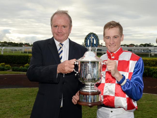 ** FILE ** A Saturday, May 17, 2014 file photo of trainer Guy Walter (left) and jockey Blake Shinn posing with the trophy after winning the Doomben Cup with their horse Streama in Brisbane.  Mr Walter has died of a suspected heart attack on Thursday, May 22, 2014.  (AAP Image/Dan Peled) NO ARCHIVING