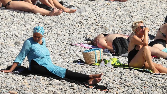 A woman enjoys the sunshine in Nice.