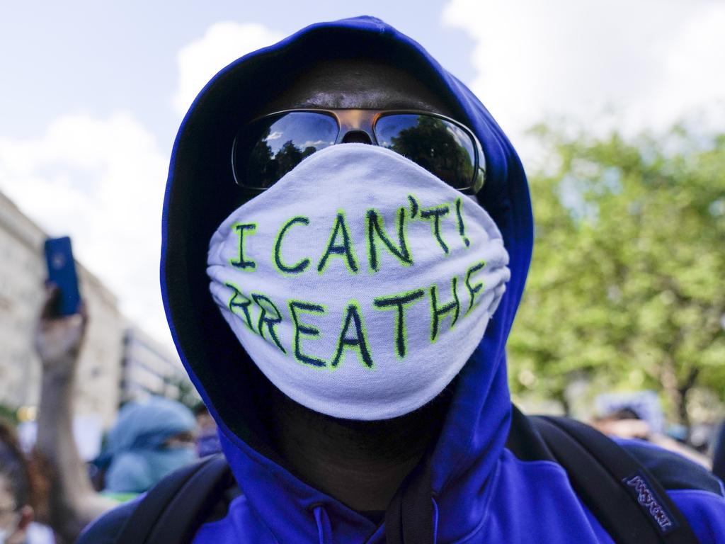 A demonstrater with the “I can’t breathe” — words uttered by George Floyd shortly before his death — protests near the White House. Picture: AP