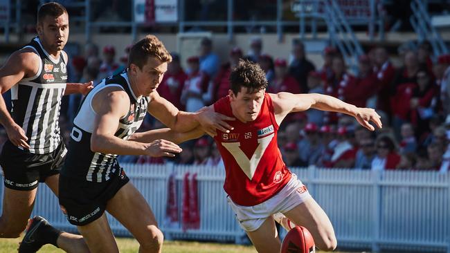 Port's Jack Trengove and North's Sam McInerney battle for the ball during their clash at Prospect Oval on Saturday. Picture: AAP/Matt Loxton