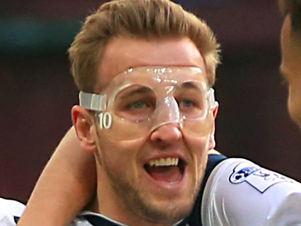 Tottenham Hotspur's Harry Kane, left, celebrates scoring his side's second goal of the match with team-mates Dele Alli, right, and Erik Lamela during the English Premier League soccer match at Villa Park, Birmingham, England. Sunday March 13, 2016. (Nick Potts /PA via AP) UNITED KINGDOM OUT - NO SALES - NO ARCHIVES