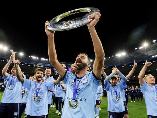 PERTH, AUSTRALIA - MAY 19:  Alex Brosque of Sydney FC holds the trophy aloft for fans after  the 2019 A-League Grand Final match between the Perth Glory and Sydney FC at Optus Stadium on May 19, 2019 in Perth, Australia. (Photo by Will Russell/Getty Images)