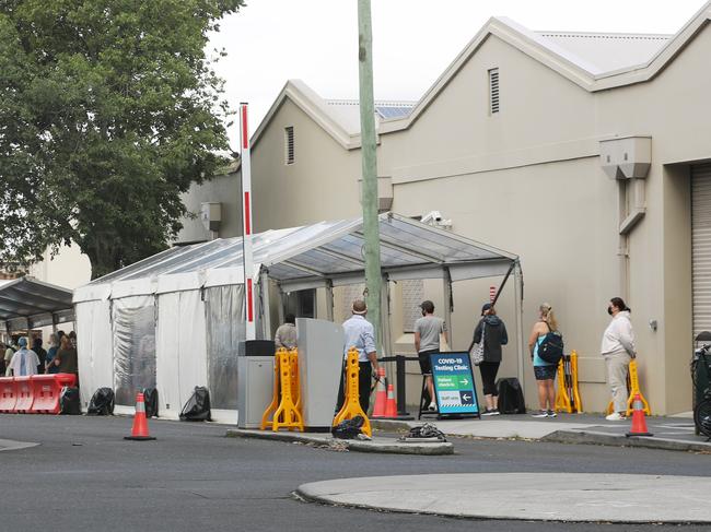 Covid testing lines snake around lanes and buildings at the RPA hospital in Camperdown. Picture: John Grainger