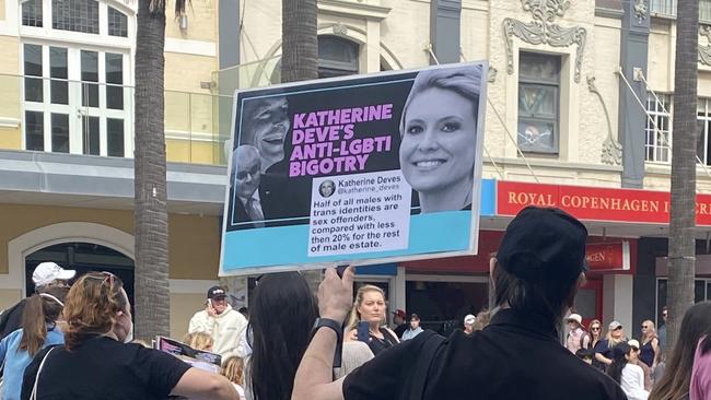 One placard featured Deves’ smiling face next to a screenshot of one of her resurfaced anti-transgender tweets. Picture: Dana Pendrick