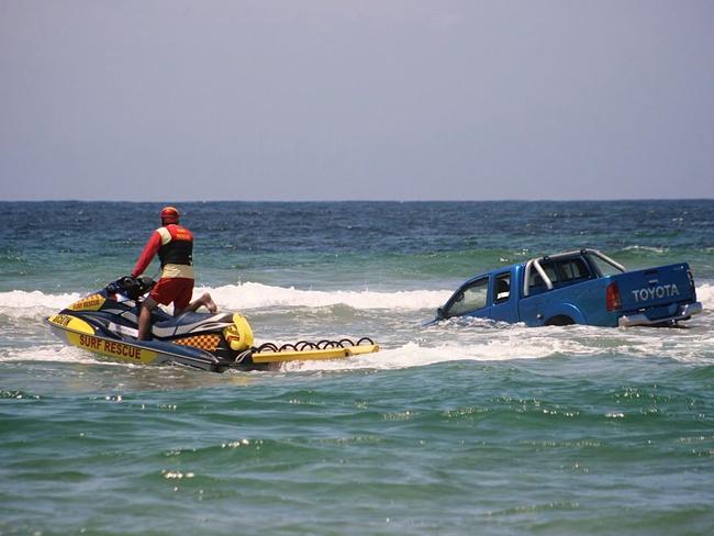 A HiLux was caught up in the force of the channel.