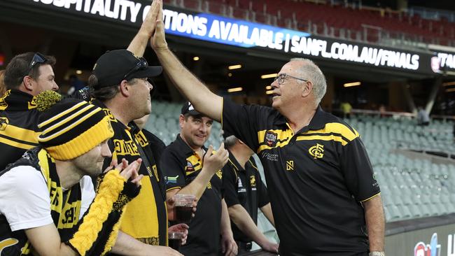 Glenelg legend Peter Carey enjoys the win with the fans. Picture: Sarah Reed