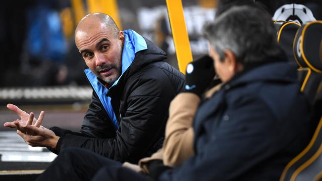 Manchester City manager Pep Guardiola in the dugout during their 3-2 defeat to Wolves at Molineux. Picture: Getty Images