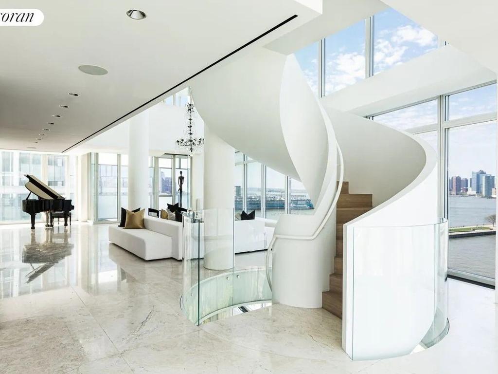 The spiral staircase connects all three levels. Picture: Realtor.com