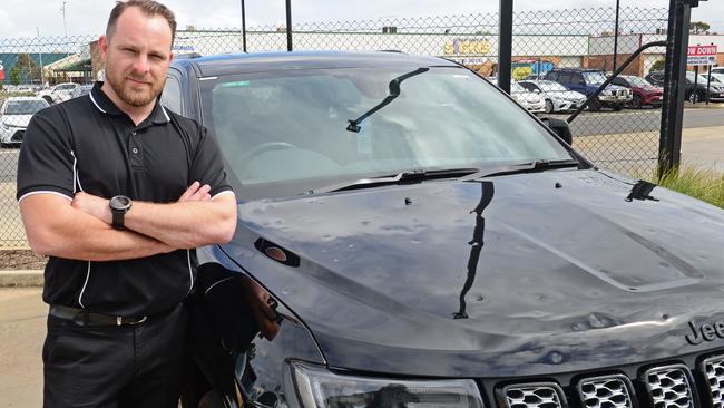 Peter Kittle Toyota collision manager Chad Buckley with a customers hail damaged car at Para Hills West after the October 28 storm. Picture: Michael Marschall