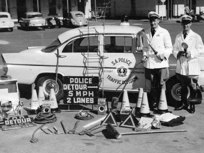 1962: South Australian police traffic control officers Constables P. S. Jalfon and M.P. Cornish show off the safety equipment they have at their disposal. Picture: Vern Thompson/File