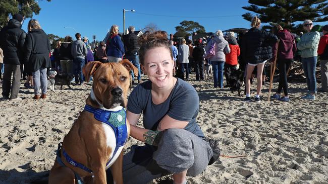 Dog owner Bridget Delaney with her 11-month-old staffy cross Bruno at Kingston Beach rally todya. Picture: LUKE BOWDEN