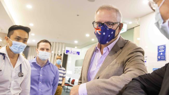 Scott Morrison greets people on arrival at Castle Hill Medical Centre in Sydney on Sydney. Picture: Jenny Evans