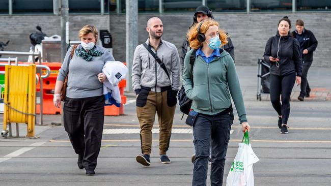 Some Melbourne residents have already taken to wearing face masks. Picture: Jake Nowakowski