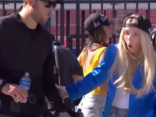 Matt Stafford and his wife react after a woman falls off stage at the Super Bowl parade.