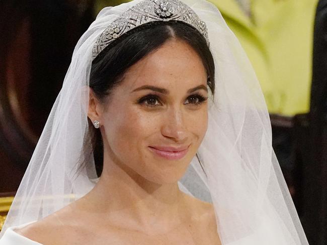 TOPSHOT - US fiancee of Britain's Prince Harry, Meghan Markle arrives at the High Altar for their wedding ceremony in St George's Chapel, Windsor Castle, in Windsor, on May 19, 2018. / AFP PHOTO / POOL / Jonathan Brady