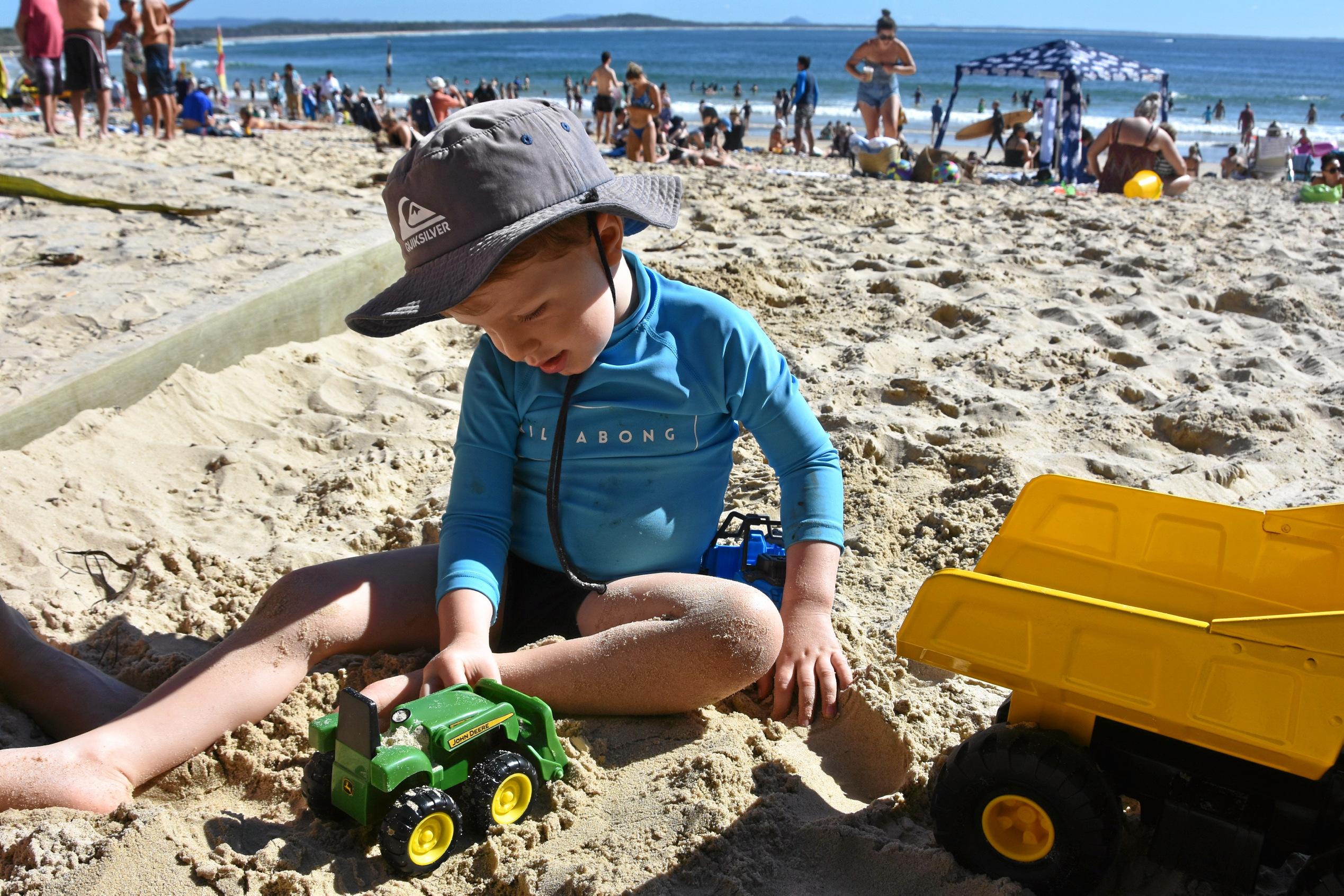 NOOSA HOLIDAYS: Vincent Murphy, 2, has fun playing with his toy truck in the sand at Noosa. Picture: Caitlin Zerafa