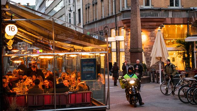 Diners in Stockholm on March 27. Unlike many countries, Sweden never imposed a lockdown. Picture: AFP