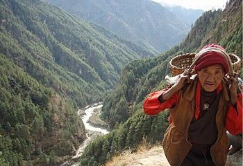 Mystical journey ... a Sherpa woman on a mountain path / Brad Crouch