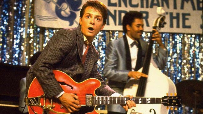 Michael J. Fox’s Marty McFly belts out Johnny B. Goode at the Enchantment Under the Sea school dance.