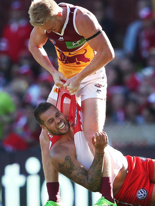 Nick Robertson wrestles Lance Franklin to the ground. Picture: Phil Hillyard