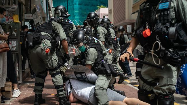 A man is detained by riot police during a demonstration on July 1, 2020 in Hong Kong, China. Hong Kong marks the 23rd anniversary of its handover to China on July 1 after Beijing imposed the new national security law. Picture: Anthony Kwan/Getty Images