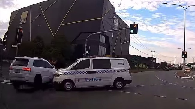 Dashcam footage has captured the nail-biting moment a car was inches away from colliding with a police vehicle on the Gold Coast. Picture: Facebook