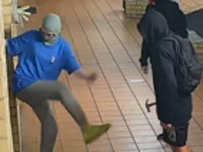 Youths pictures breaking into the Black Lime Cafe in Carrara.