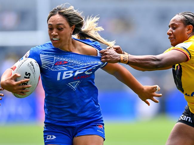 SYDNEY, AUSTRALIA - NOVEMBER 10: Sarina Masaga of Fetu Samoa is tackled by Leila Kerowa of PNG Orchids during the 2024 Pacific Championships Pacific Bowl Women's final match between PNG Orchids and Fetu Samoa at CommBank Stadium on November 10, 2024 in Sydney, Australia. (Photo by Izhar Khan/Getty Images)