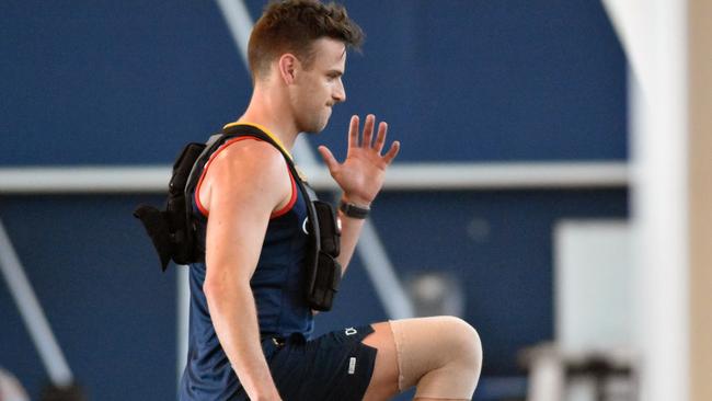 Adelaide’s Brodie Smith in the gym recovering from a knee reconstruction.