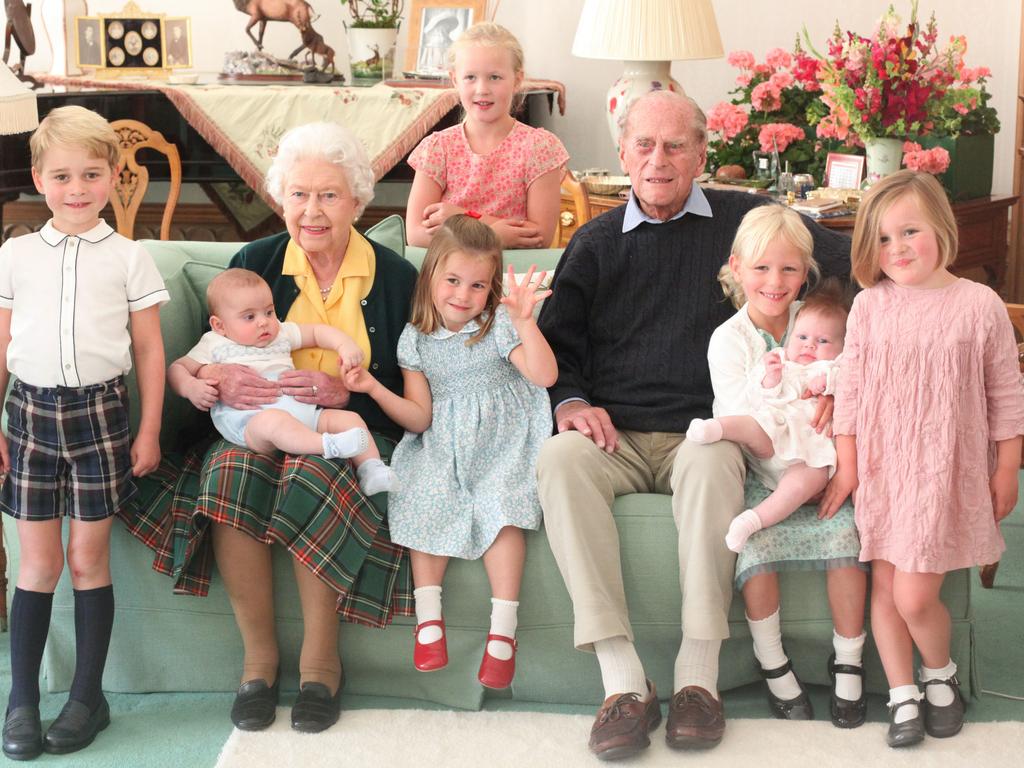 The Queen and Prince Philip with their great grandchildren (L-R) Prince George, Prince Louis being held by Queen Elizabeth II, Savannah Phillips (standing at rear), Princess Charlotte, Prince Philip, Duke of Edinburgh, Isla Phillips holding Lena Tindall, and Mia Tindall in 2018 in United Kingdom. Picture: The Duchess of Cambridge via Getty Images