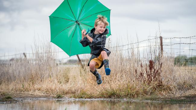 Horsham’s Nate Keating, 5, jumps in a muddy puddle in January this year after the first rain in months fell in drought-affected areas of western Victoria. The Bureau of Meteorology says chances are improving for a wet winter and spring this year. Picture: Jake Nowakowski