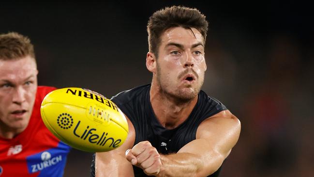 MELBOURNE, AUSTRALIA - MARCH 03: George Hewett of the Blues is chased by Tom McDonald of the Demons during the 2022 AFL Community Series match between the Carlton Blues and the Melbourne Demons at Marvel Stadium on March 3, 2022 In Melbourne, Australia. (Photo by Michael Willson/AFL Photos via Getty Images)