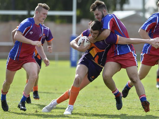 Josh Keoller of Darling Downsmakes a strong tackle.