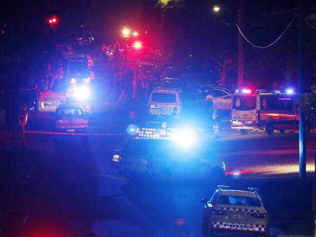 The street remained a hive of police activity into the night. Picture: Josh Woning