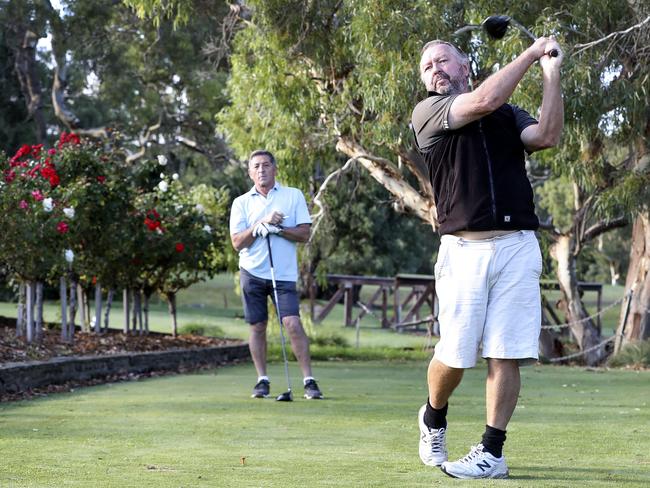 Mark McPherson (left), from McLaren Vale, and Brenton Irving, from Seaford, tee off at Willunga Golf Club. Picture: Sarah Reed