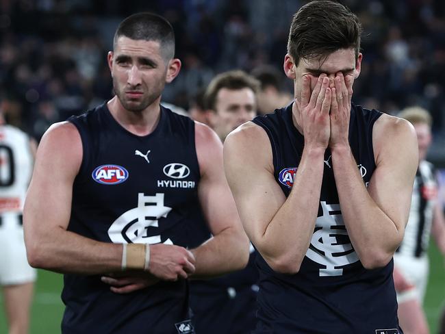 Jacob Weitering and Lewis Young walk off the MCG after their shattering loss to Collingwood at the end of the 2022 season. Picture: Michael Klein