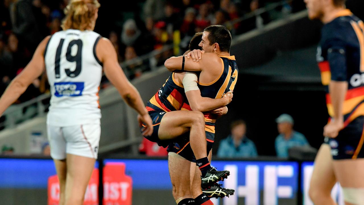 Lachlan Murphy and Taylor Walker of the Crows celebrate a goal against the Giants. Picture: AAP Image/Sam Wundke